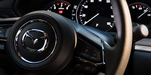 Close up of a black Mazda Steering Wheel | Mazda Dealer in Ellisville, MO