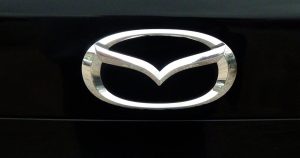 Silver Mazda symbol with black Background. | Mazda Dealer in Ellisville, MO