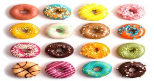 Four rows of colorful donuts with four on each row. | Ellisville, MO