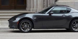 Profile of a parked charcoal 2019 Mazda MX-5 Miata. | Mazda dealer in Ellisville, MO.