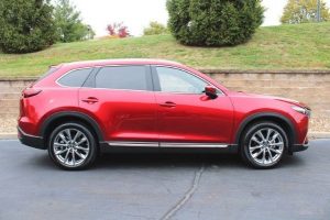 Profile view of a red 2019 Mazda CX-9 Grand Touring | Mazda dealer in Ellisville, MO