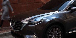 Close up view of the front half of a dark gray 2019 Mazda CX-9 | Mazda dealer in Ellisville, MO